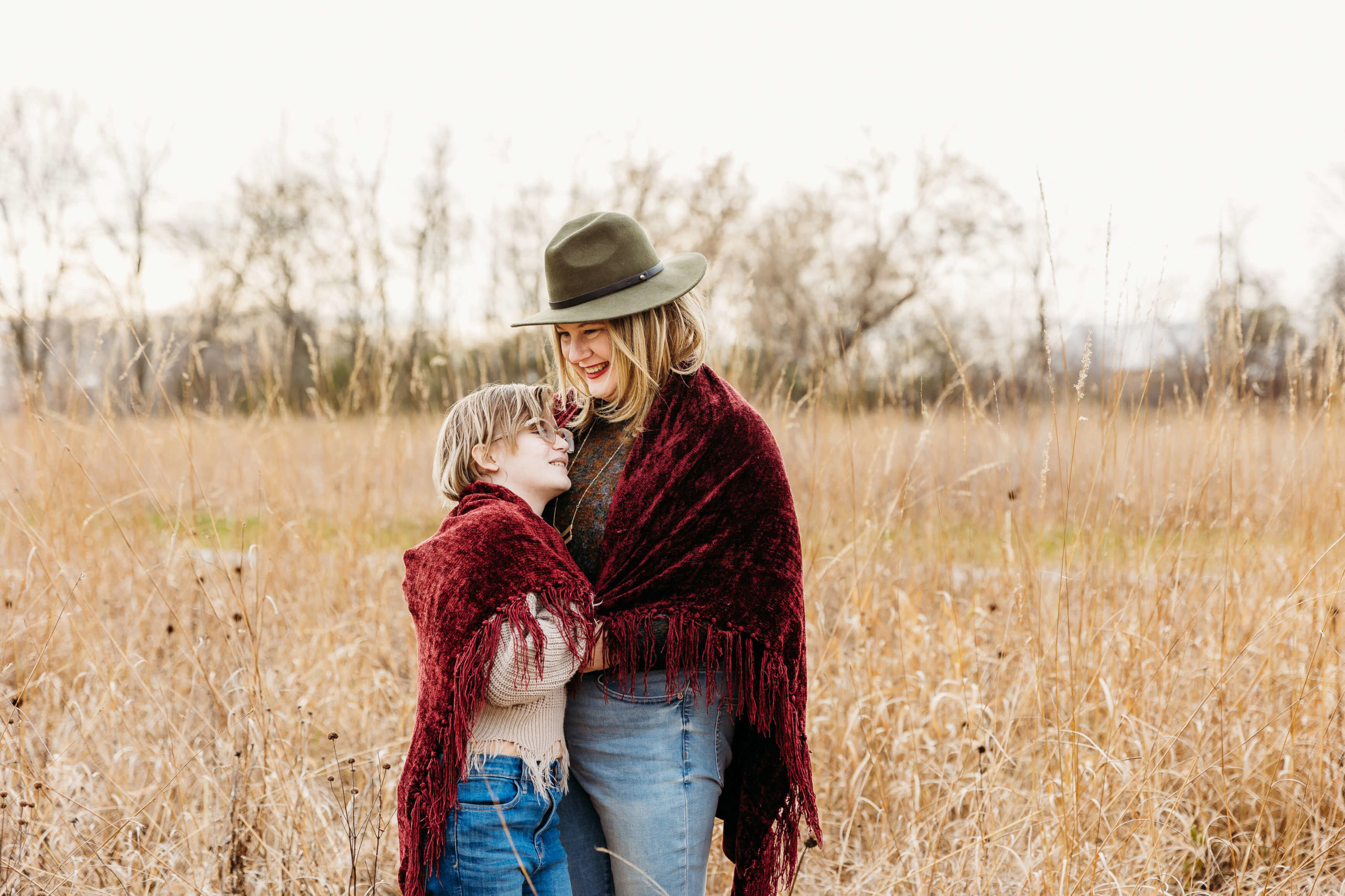 Mother and daughter snuggling together wearing clothes from a boutique in oshkosh wi