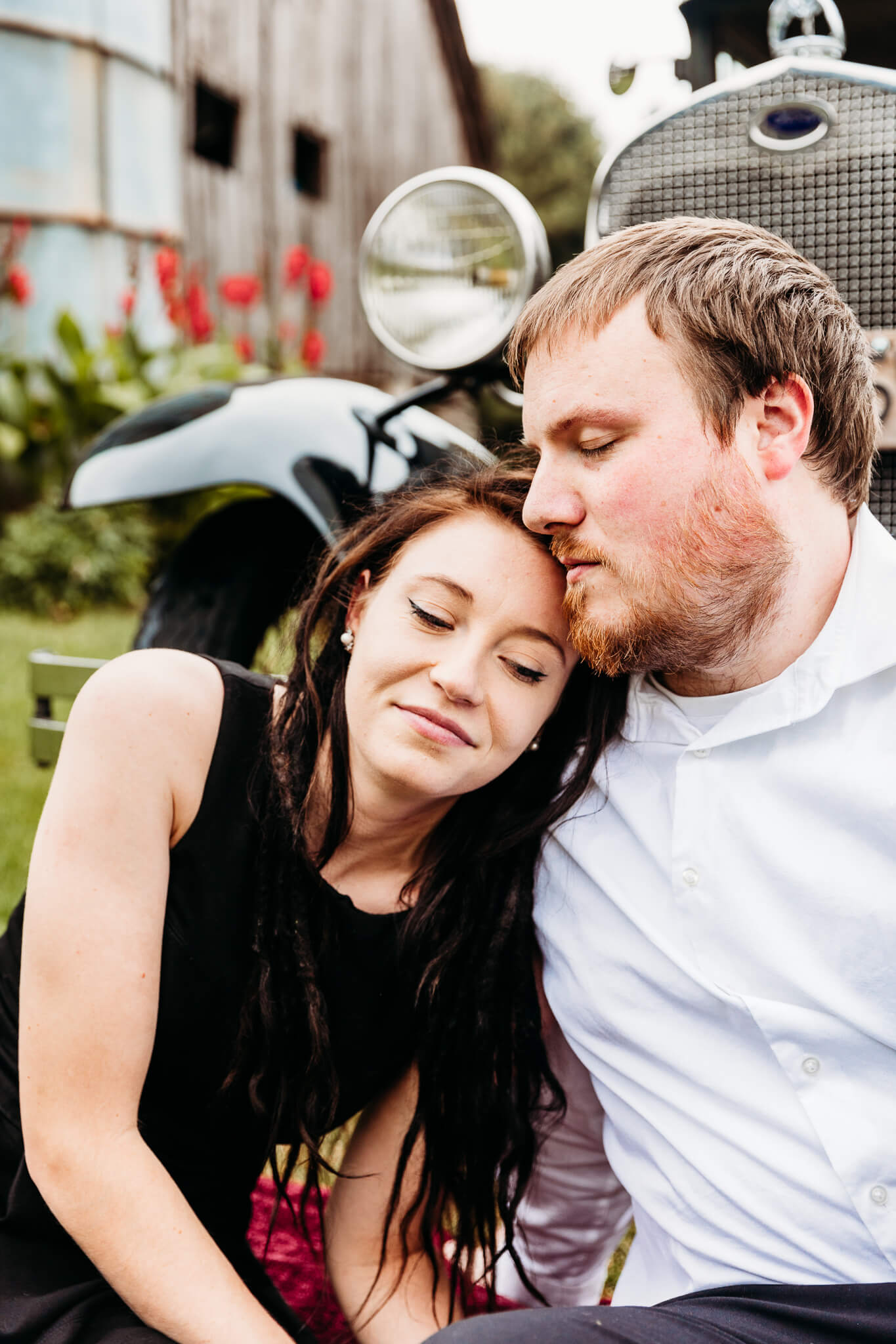 beautiful engaged couple cuddling together by Ashley Kalbus Photography best restaurants in Oshkosh