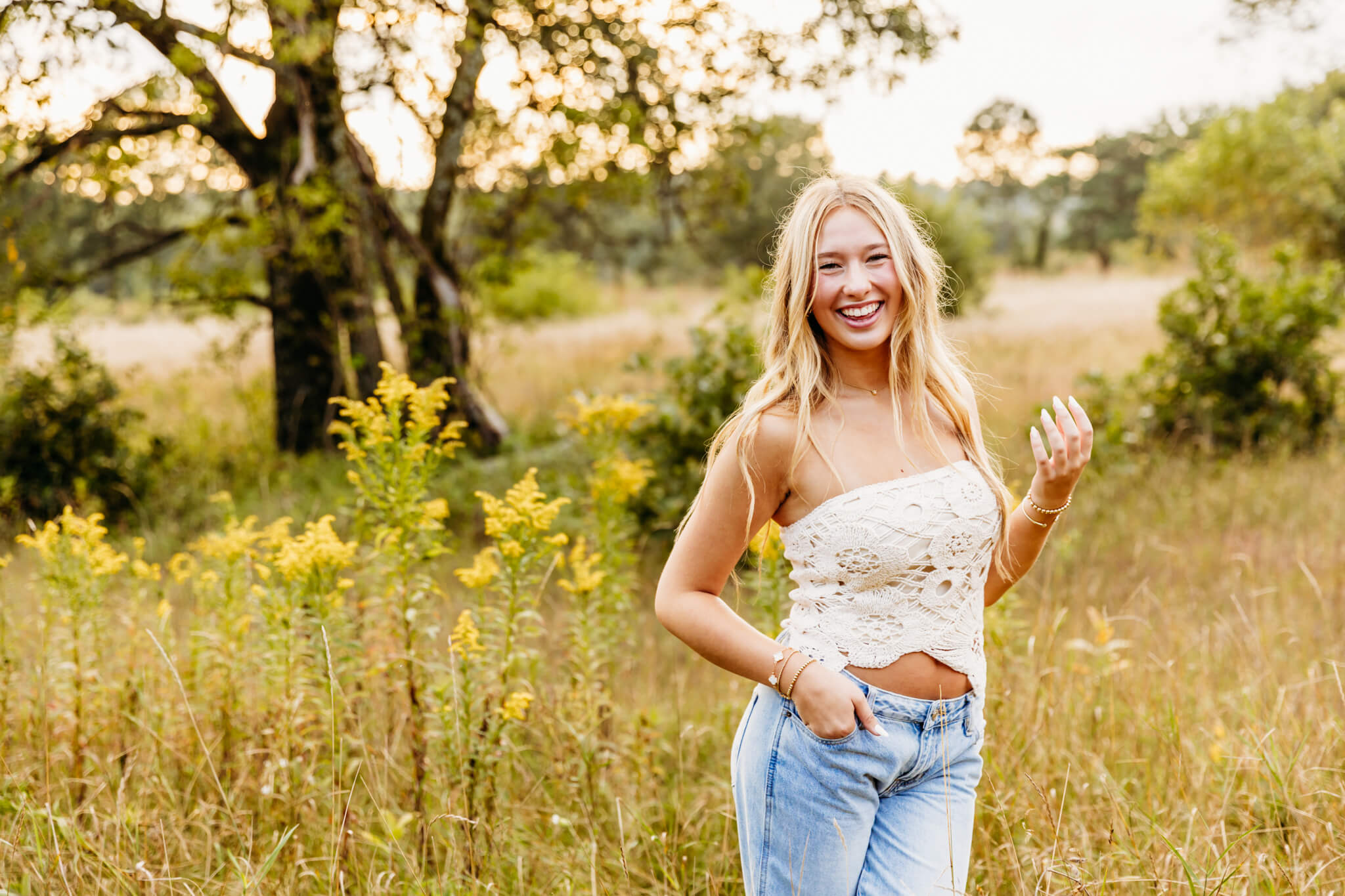 gorgeous student from Neenah High School laughing as she enjoys her photo session