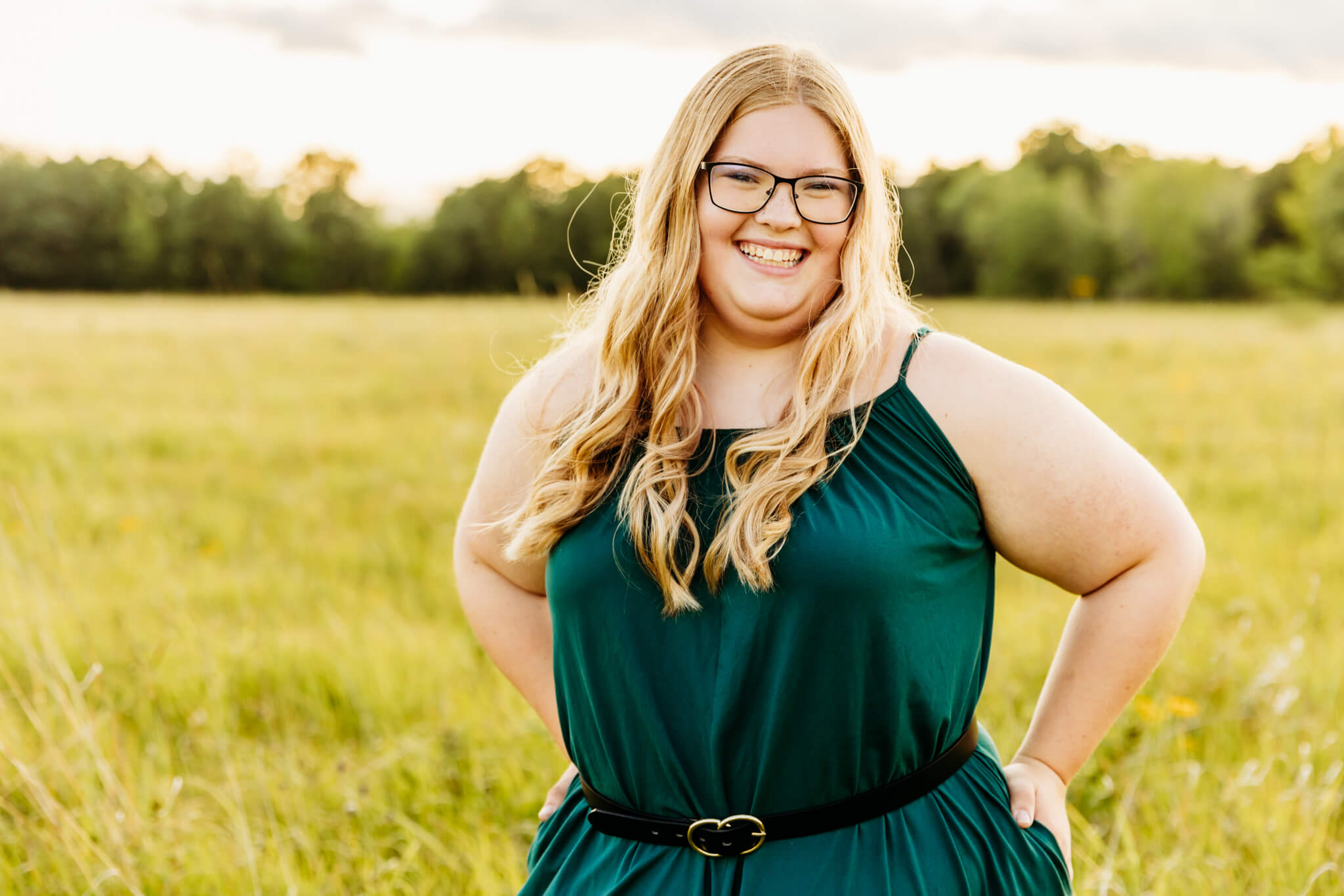 senior from a high school in Green Bay laughing during her photo session