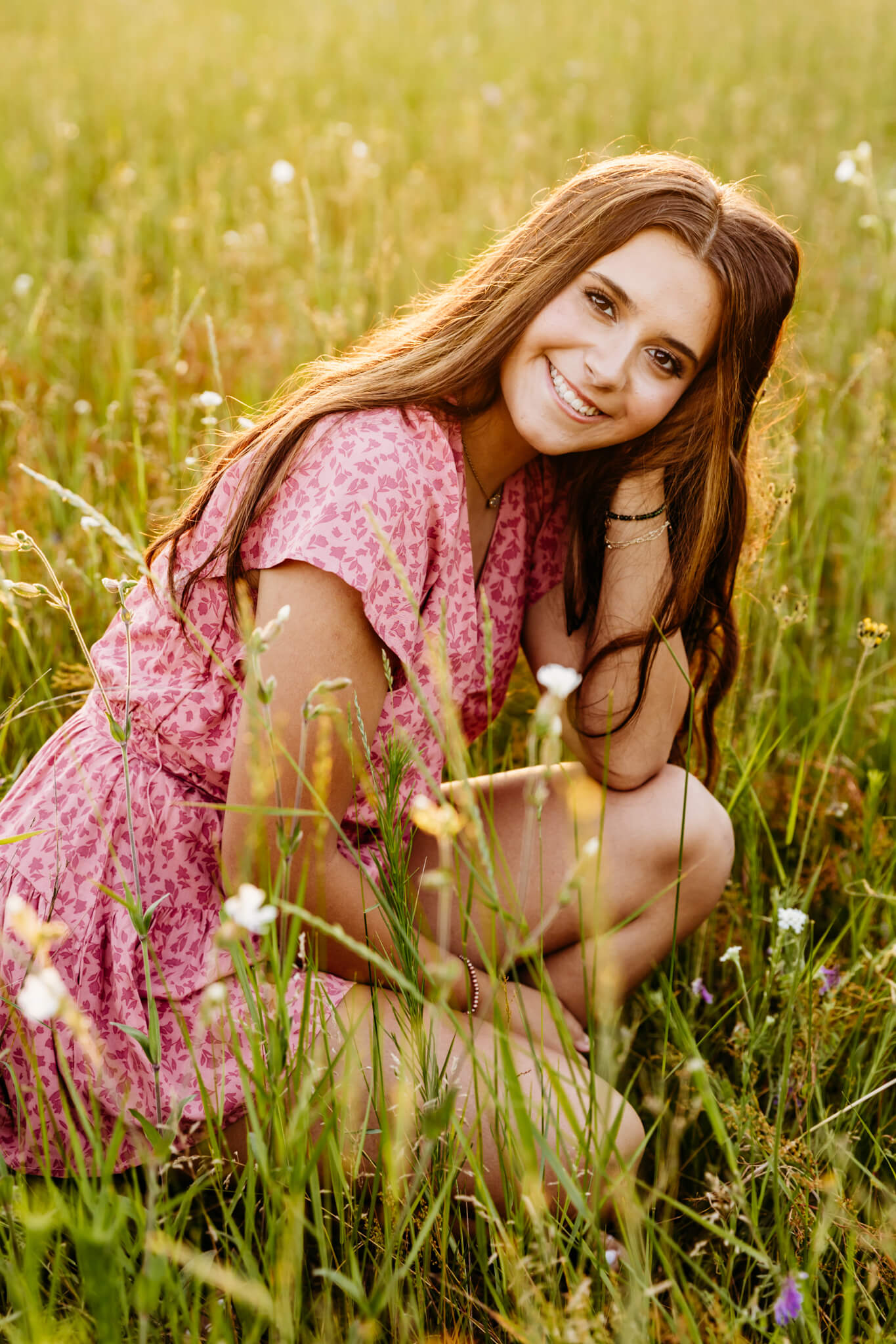 high school senior smiling and looking gorgeous with her makeup done by Stephanie Schuh Beauty for her senior photo session