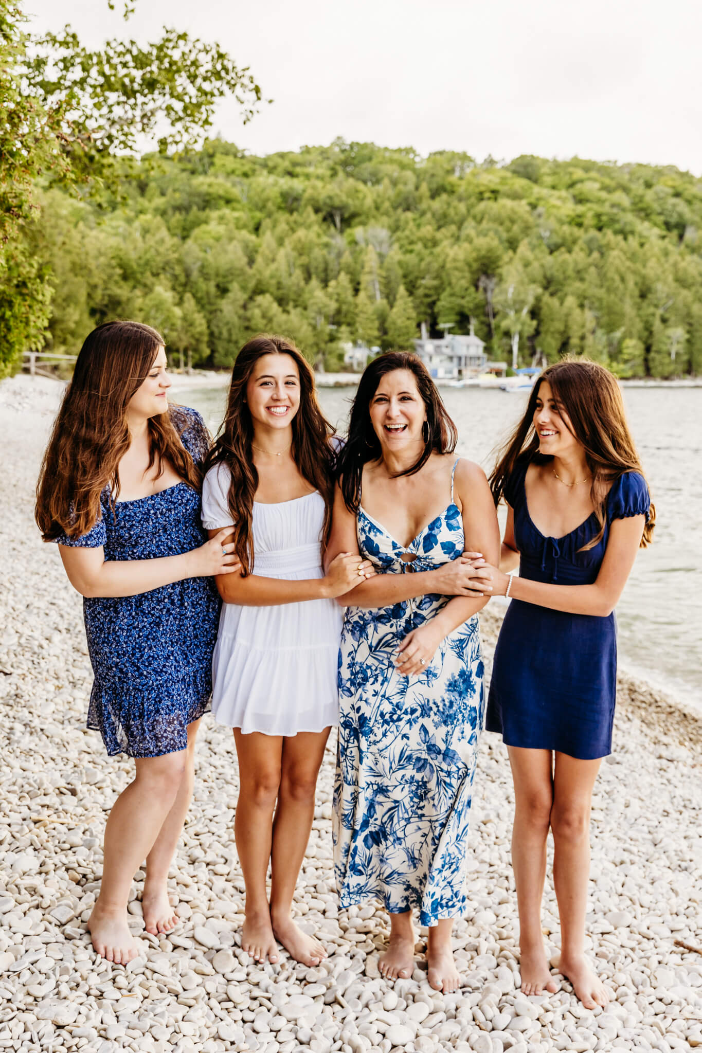 mother with her three daughters standing on a beach in Door County